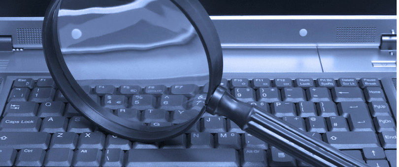 Magnifying glass on a keyboard