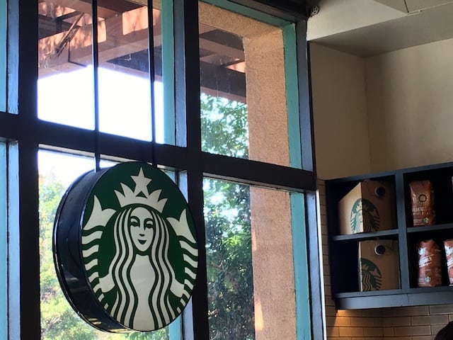 Starbucks coffee sign in a window