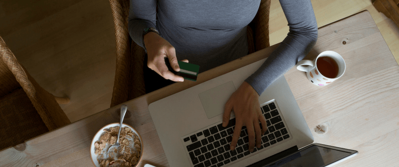 Woman ordering online over breakfast