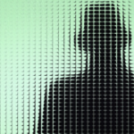 a mysterious silhouette standing behind green, frosted glass