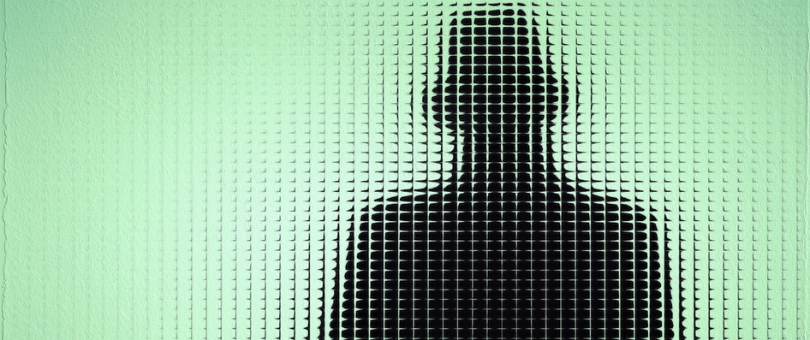 a mysterious silhouette standing behind green, frosted glass