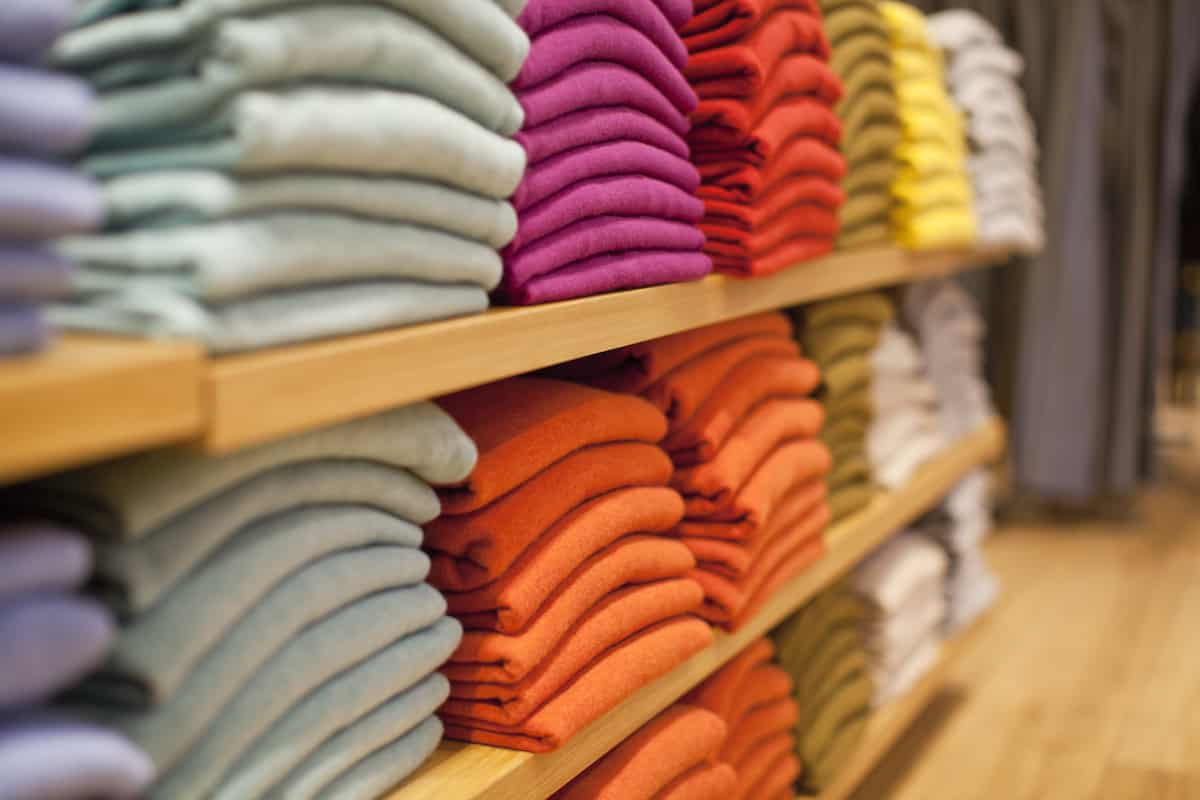 Neatly folded sweaters at a retail shop