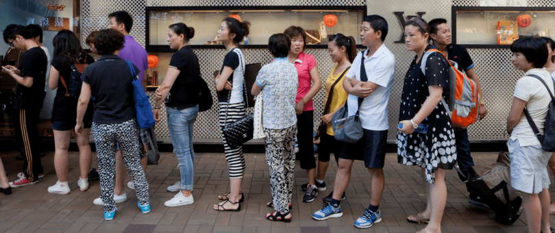 a long line of customers at a retail store