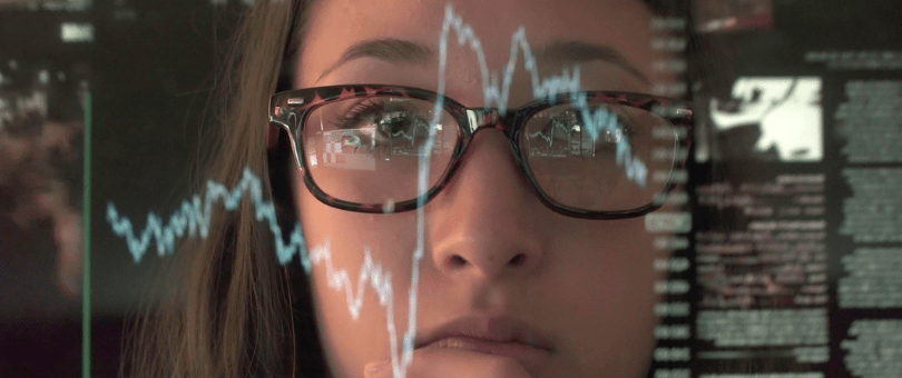 A woman examining test results of a digital system