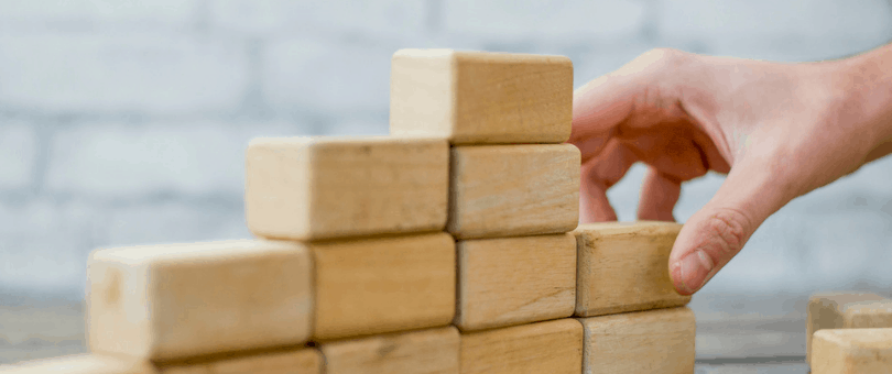 Building a stack of blocks to symbolize building an ecommerce tech stack