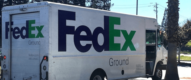 FedEx Ground delivery truck picking up ecommerce returns