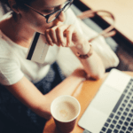 Consumer pondering an online order delay at laptop