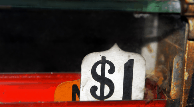Old-time cash register showing a $1 sale
