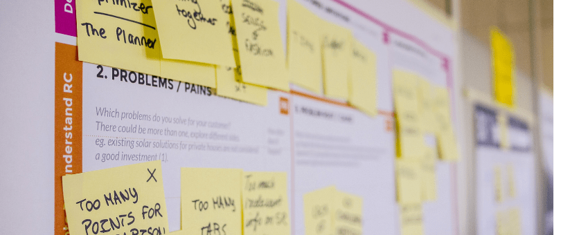 A design scum board on better ecommerce customer experience with yellow sticky notes