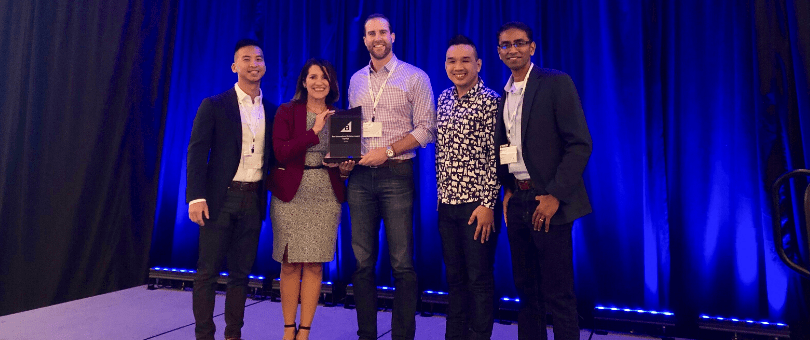 Signifyd's Chris Jow, Skye Spear and Vid Sumukar accepting BigCommerce Technology Partner of the Year Award