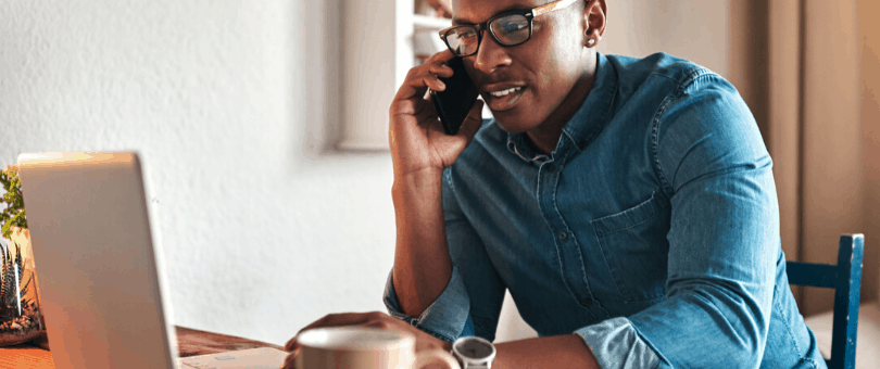 Man working from home with laptop mobile phone