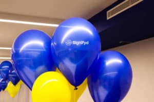 Blue and yellow Signifyd balloons welcoming new Belfast hires