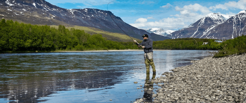 Man fly fishing in a mountain stream to illustrate Mack's Prairie Wing customer story
