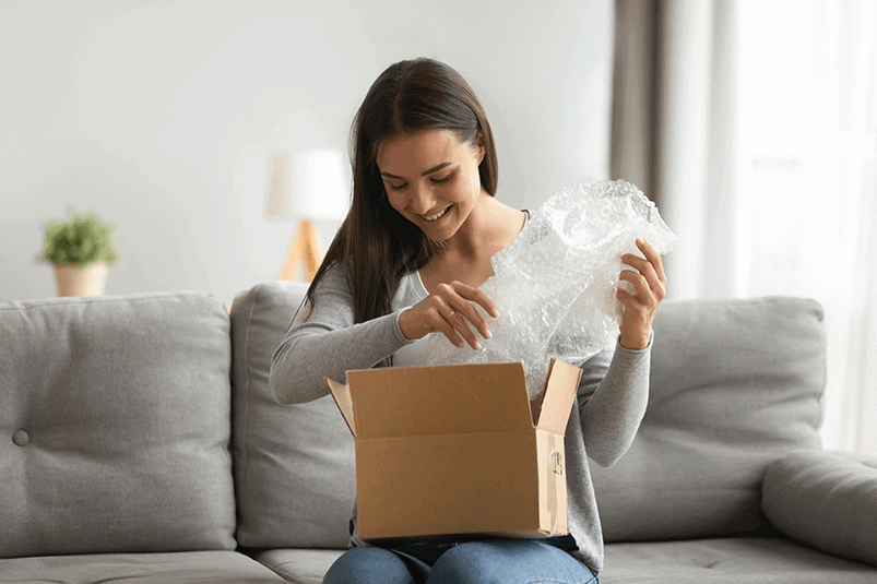 Woman opening a box