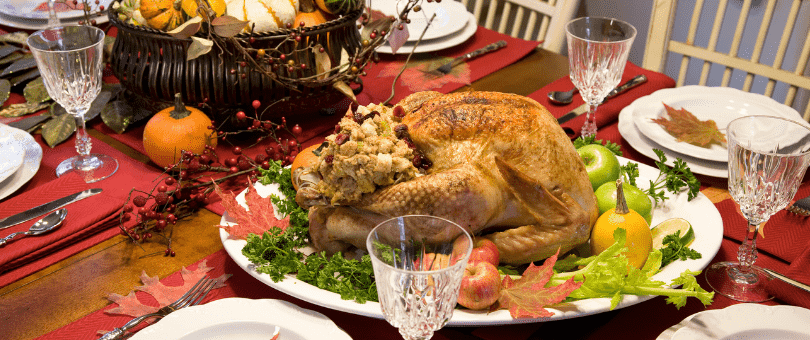 elegant Thanksgiving dinner on the table with Turkey center stage