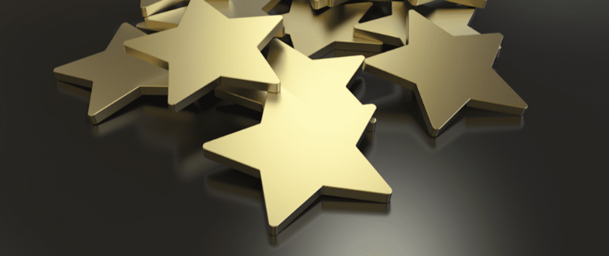 Pile of gold stars to symbolize Signifyd's being named top customer success organization