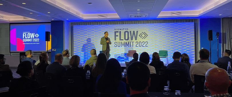 Raj Ramanand on stage at Signifyd FLOW Summit 2022