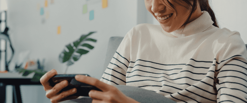 Woman smiling over successful online payment