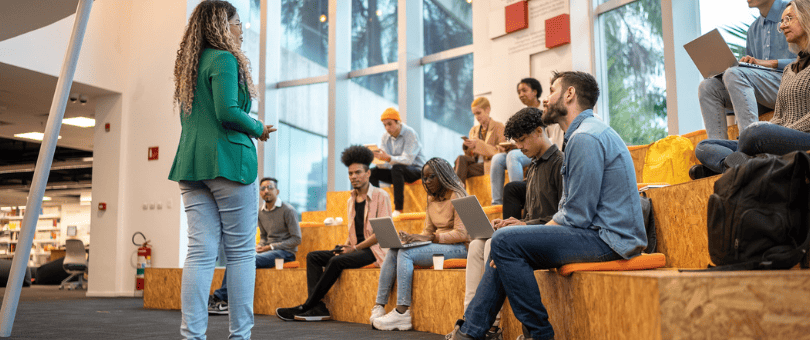 Interns on risers getting a welcome speech from company person