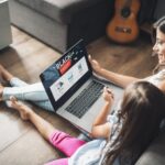 Mother and daughter shopping on a laptop on Black Friday