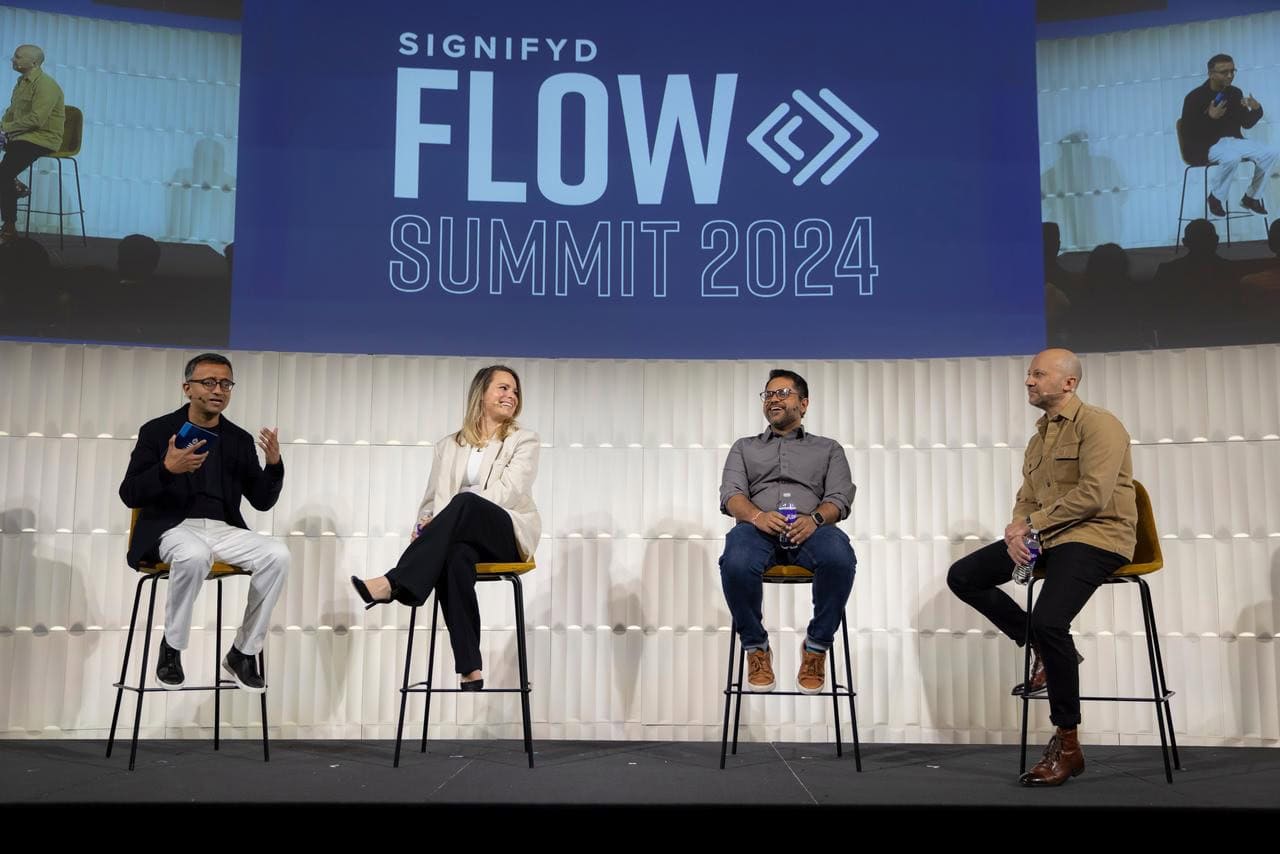 Panelists, including Signifyd CEO Raj Ramanand on stage at Signifyd FLOW Summit 2024.