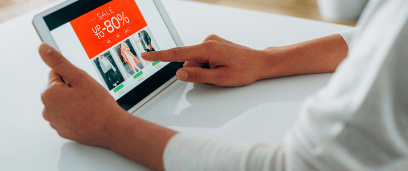 Online shopper looking at ecommerce promo to illustrate promo abuse bloig