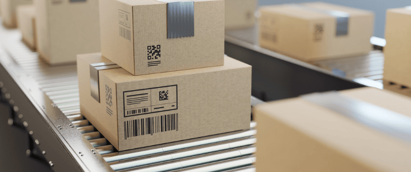 ecommerce packages on conveyer belt to illustrate de minimis blog
