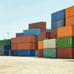 Shipping containers stacked in a port for Signifyd/Talker merchant survey blog