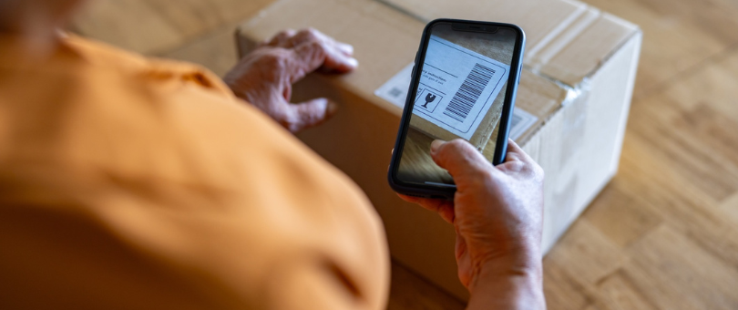 A woman scanning a return for check-in to illustrate ecommerce return optimization