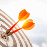 Two darts in a bullseye to symbolize fraud detection accuracy