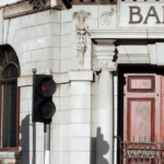 A classic bank facade with wooden door to illustrate Signifyd's post on improving bank authorization rates