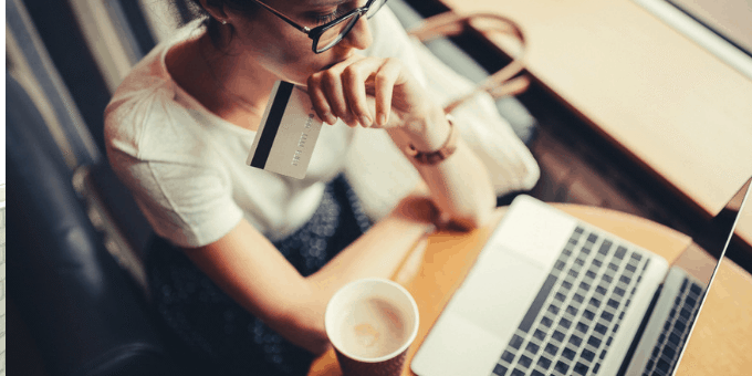 Consumer pondering an online order delay at laptop