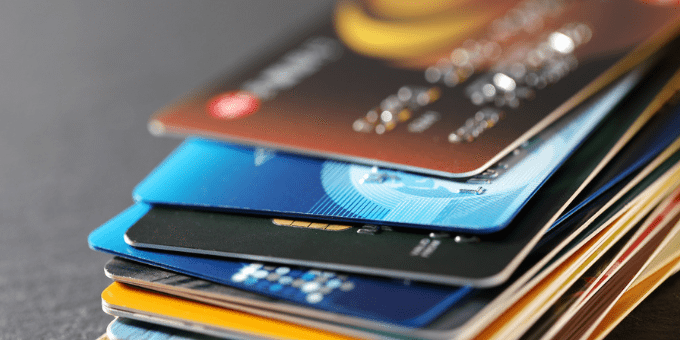 A stack of credit cards to illustrate Signifyd's Visa CE 3.0 blog post
