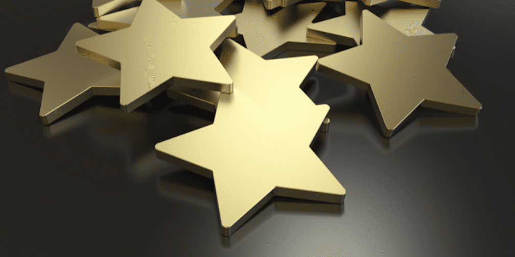 Pile of gold stars to symbolize Signifyd's being named top customer success organization