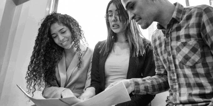 Financial team studying results and conferring