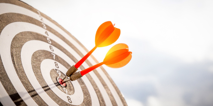 Two darts in a bullseye to symbolize fraud detection accuracy