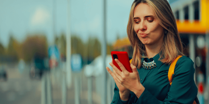 Woman with a mobile, looking like she's up to something for the SNAD and INR blog post