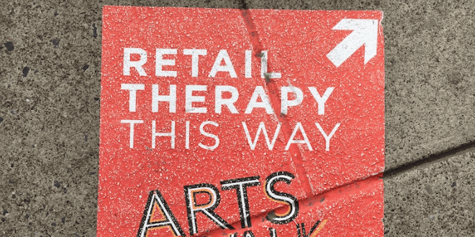 A Retail Therapy sign painted on the sidewalk in Allentown, Pennsylvania