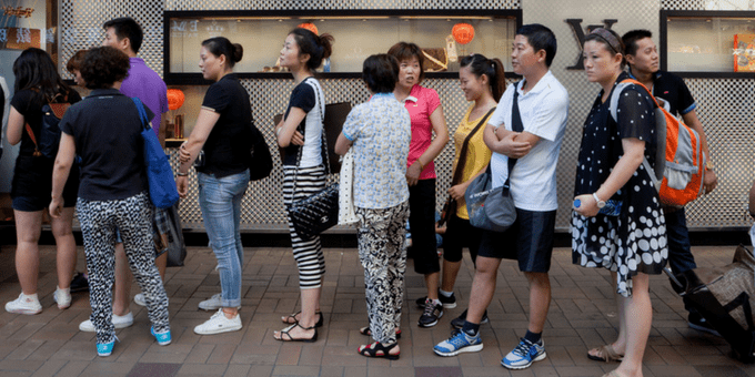 a long line of customers at a retail store